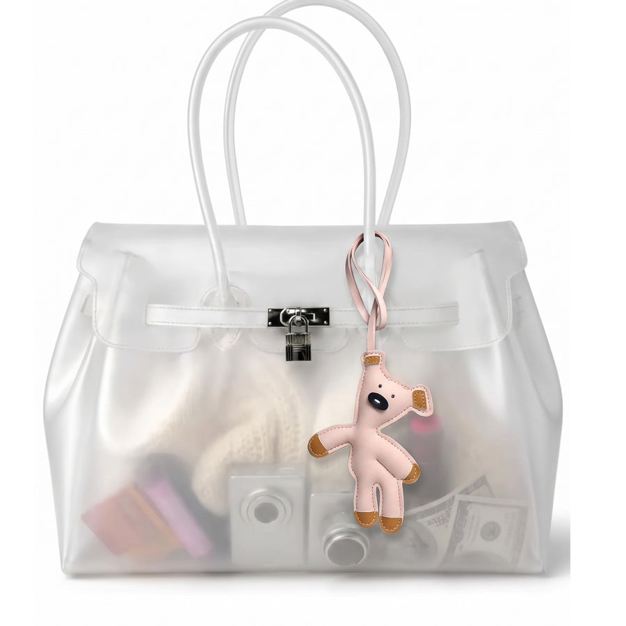 Charm ourson coloris Rose suspendu à l'anse du sac Jelly transparent