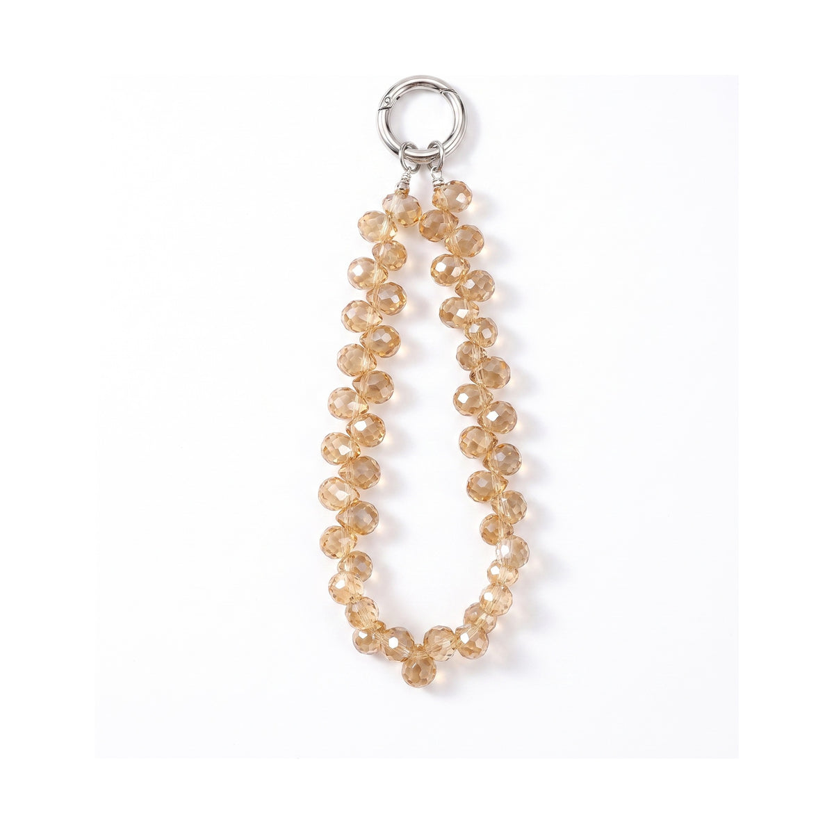 Charm effet cristal Cristal Gold, perles facettées et anneau métal, sur fond blanc