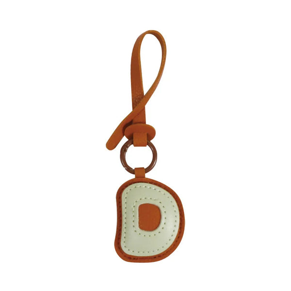 Charm lettre en cuir, le bijou de sac à ton initiale, coloris D · Vanille