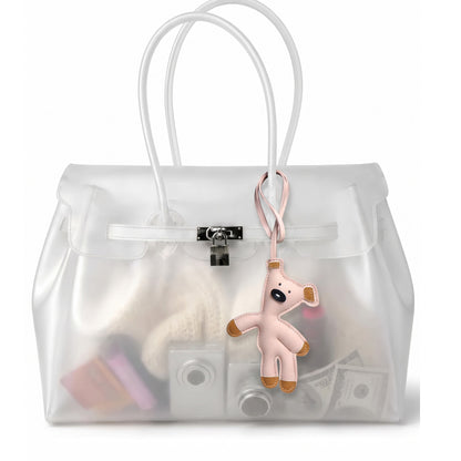 Charm ourson coloris Rose suspendu à l'anse du sac Jelly transparent