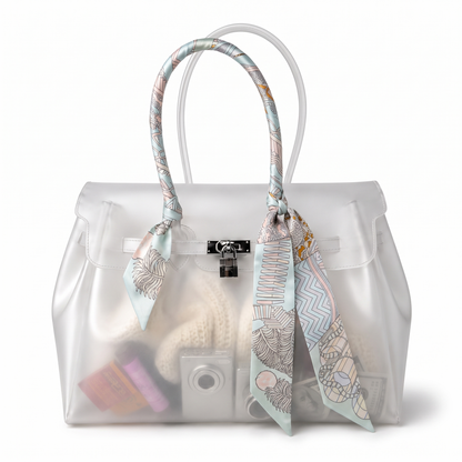 Foulard motif Nao noue sur l anse d un sac cabas transparent Le MAGA edit