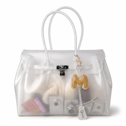 Charm lettre M duo Miel noue sur l anse d un sac cabas transparent Le MAGA edit