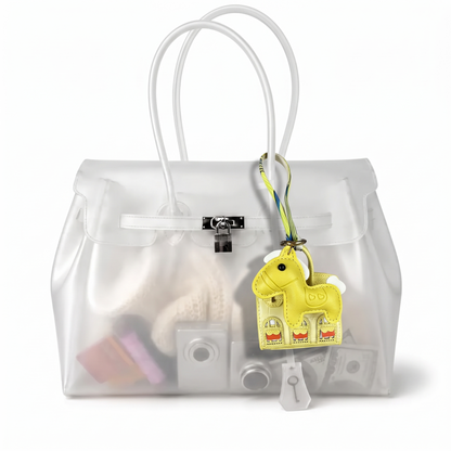 Mini Jelly coloris Jaune suspendu à l'anse du sac Jelly transparent