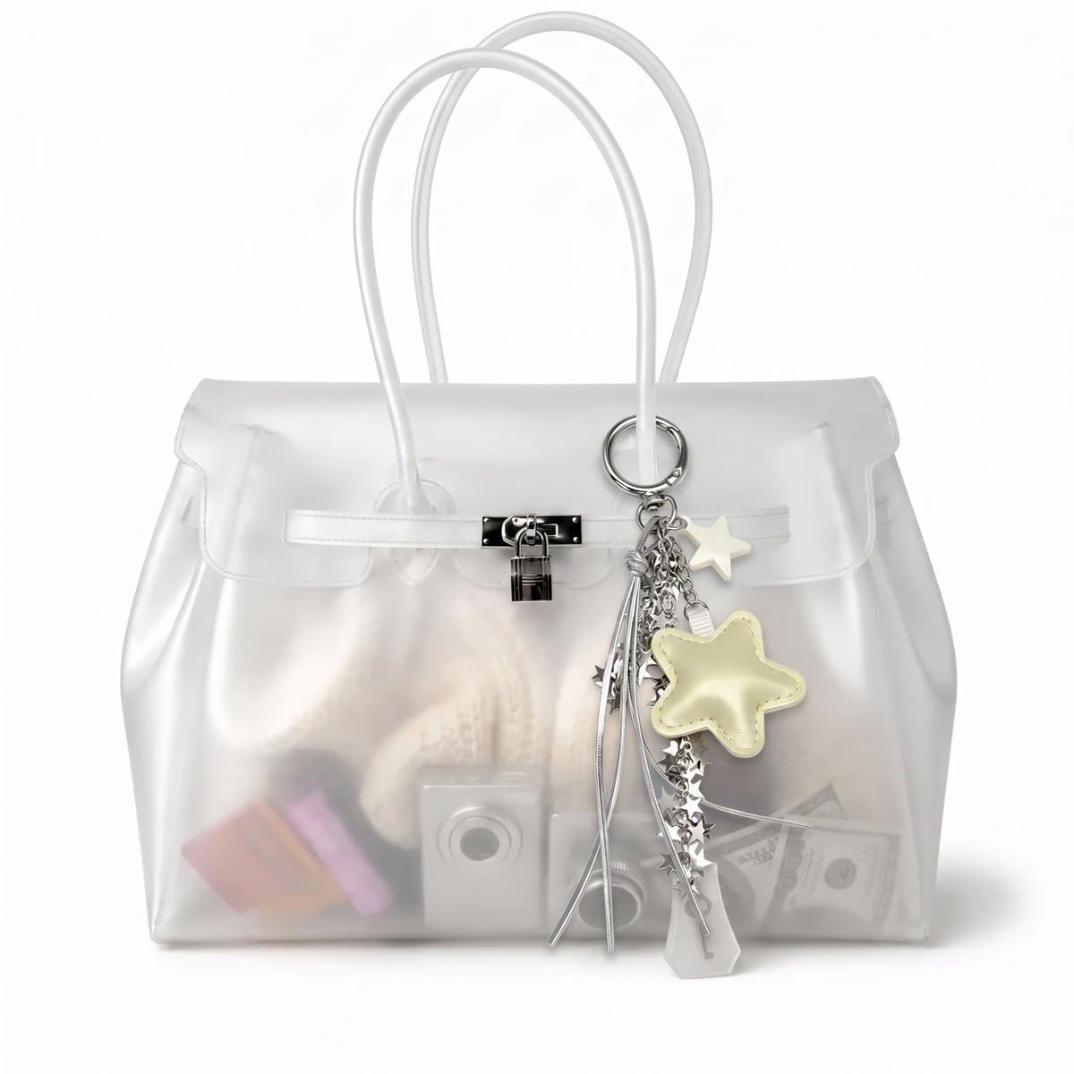 Charm étoile coloris Jaune suspendu à l'anse du sac Jelly transparent