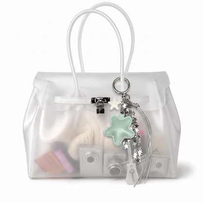 Charm étoile coloris Vert suspendu à l'anse du sac Jelly transparent