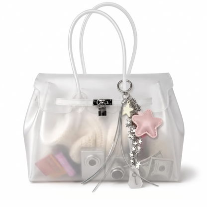 Charm étoile coloris Rose suspendu à l'anse du sac Jelly transparent