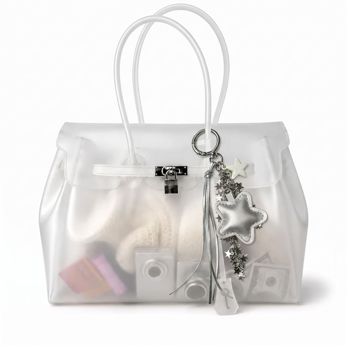 Charm étoile coloris Argenté suspendu à l'anse du sac Jelly transparent