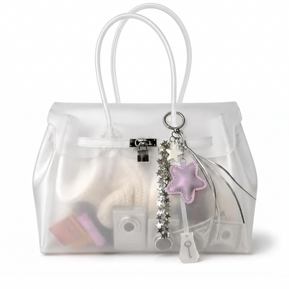 Charm étoile coloris Violet suspendu à l'anse du sac Jelly transparent